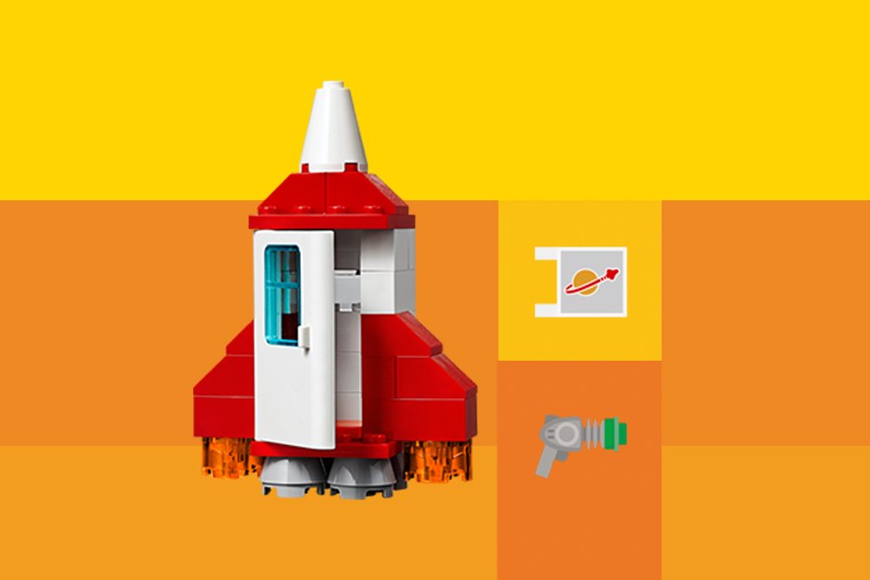 A LEGO® rocket build against yellow background.